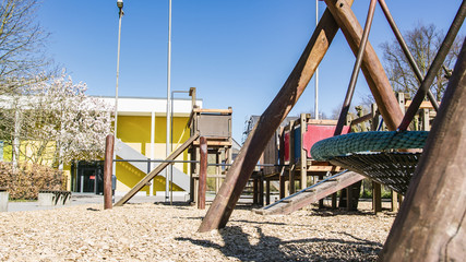 Fototapeta na wymiar Abandoned Children Playground in quarantine - nobody playing outside, stricktly forbidden - smooth tracking shot.