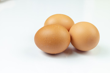 Three Chicken Eggs Isolated Above White Background