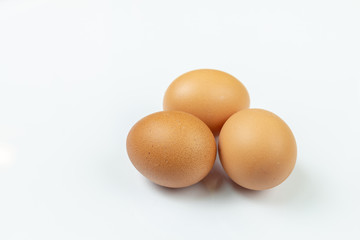 Three Chicken Eggs Isolated Above White Background