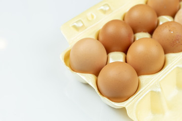 Full box with eggs isolated above white background with copy space