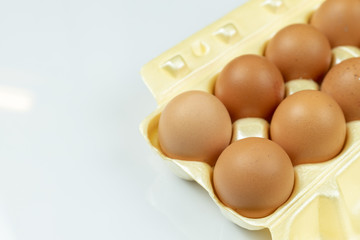 Full box with eggs isolated above white background with copy space
