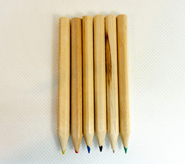 six wood little colored pencils
