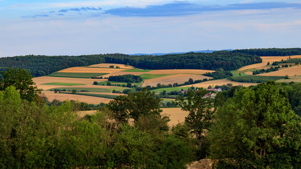 landscape with wheat field and blue sky, view on valley "Jagsttal" in Möckmühl, Germany