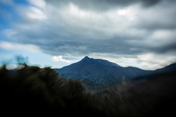 Fototapeta na wymiar Storm clouds on a mountain peak landscape