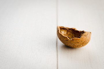 walnut shell  on a wooden surface