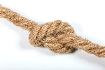 Close-up of a rope with a knot, on a white background