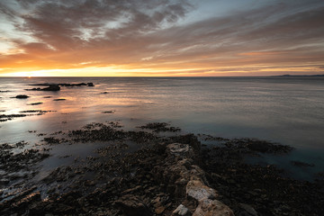 Beautiful sunrise on the sea from Shag Point, New Zealand