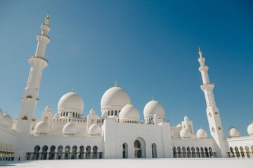 Interior square of Sheikh Zayed Mosque at blue sunny sky at Abu Dhabi