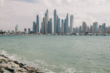 Panoramic view to Dubai business center with skyscrapers after rain