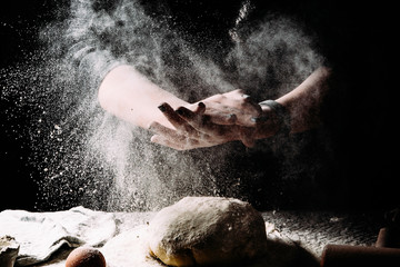 Fototapeta na wymiar Flour.Cooking the dough. Photograph in a dark vein. 