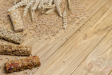Balanced protein granola bar. Spikelets of wheat, wheat grains, oatmeal.