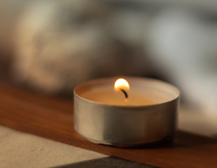 candle on the spa incense board