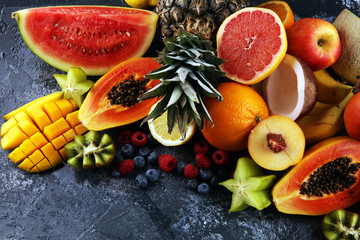 Tropical fruits background, many colorful ripe fresh tropical exotic fruits