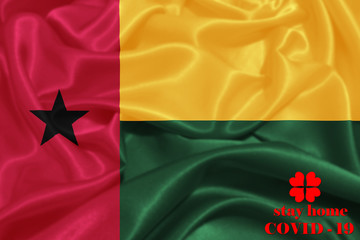 Stay Home . Coronavirus epidemic, word COVID-19. COVID-19 infection concept. Guinea-Bissau