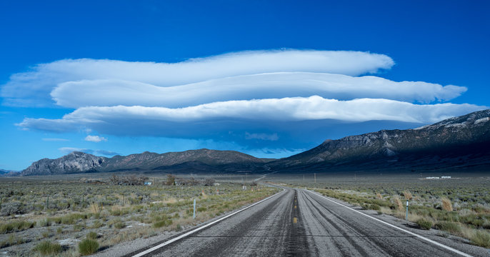 Lenticular Clouds over the Lonliest Road in the Country, US Highway 50/93 East towards Great Basin National Park in White Pine County, Nevada, USA