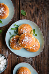 Bath buns, classic English sweet pastry glazed with syrup, topped with caraway seeds and crushed sugar cubes