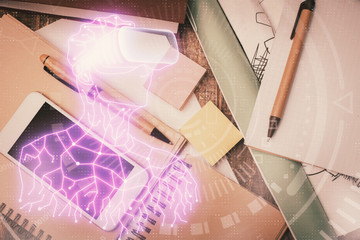 Fototapeta premium Double exposure of drawing man in AR glasses over table with phone. Top view. VR concept.