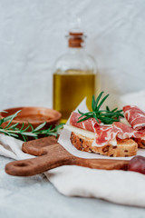 Slices of bread with spanish serrano ham served as tapas