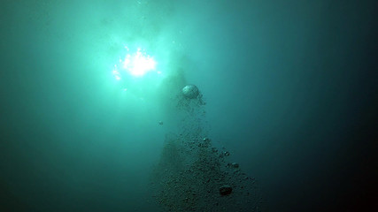 Fototapeta na wymiar Bubble in the Blue Sea Underwater Ambiance, Sun light beams