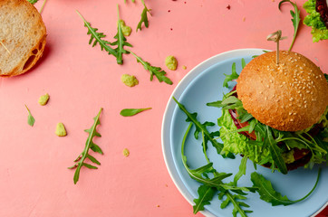 Veggie beet and lentil burgers with vegetables and avocado sauce. Healthy food concept.
