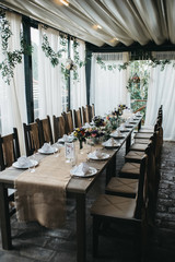  Decorated tables with candles and floral arrangements for celebration
