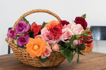 Fototapeta na wymiar bouquet of roses in a basket isolated on white