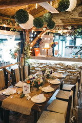  Decorated tables with candles and floral arrangements for celebration