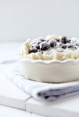  Blueberry Quiche ina Ceramic Dish on white wooden background.