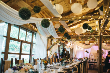  Decorated tables with candles and floral arrangements for celebration