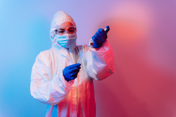 Test tube with blood sample. Scientist with biohazard protection cloth and glove for protection