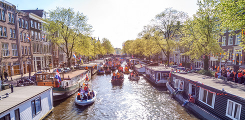 AMSTERDAM, HOLLAND - MAY 1: Tourists in Amsterdam on MAY 1, 2013. Amsterdam is one of the most...