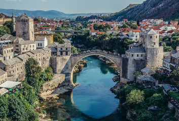Fototapeta na wymiar View with Old Bridge, reconstructed 16th century Ottoman bridge, main attraction of Mostar Old Town, Bosnia and Herzegovina