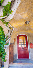 Fototapeta na wymiar Beautiful red door of a medieval house
