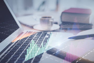 Double exposure of financial chart drawing and desktop with coffee and items on table background. Concept of forex market trading