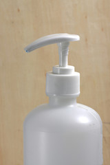 Fototapeta na wymiar close up shot of hand sanitizer on a white bottle with pump