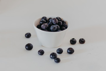 blueberries in a bowl isolated on white background