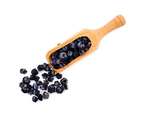 dry rot blueberry in wood scoop on white background