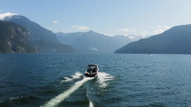 Drone footage of boat on beautiful lake 