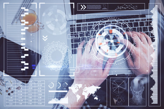 Multi exposure of man's hands typing over computer keyboard and data theme hologram drawing. Top view. Technology concept.