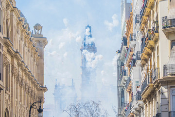 Valencia, Spain - March 19, 2019: Fireworks fired in a Mascleta Fallas during the day