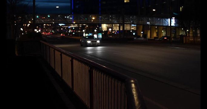 Traffic in the city with an ambulance with blue lights passing by