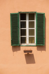 Green timber shutters on windows