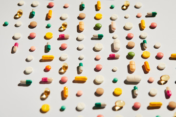 Colorful assorted pills pattern flat lay of medicine pills colorful medicine on dark background....
