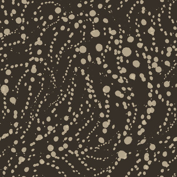 Vector seamless texture of brown color from blots or circles on a brown background. Pattern for printing on fabric or wrapping paper. Simple ornament in grunge style.