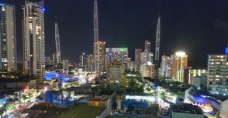 Surfers Paradise, Gold Coast. City skyscrapers and buildings at night, aerial view, Australia