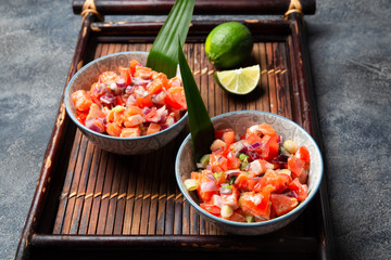Hawaiian food Salmon Lomi Lomi. Salmon with tomatoes, onion and lemon