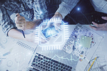 Double exposure of data theme hologram drawing and man and woman working together holding and using...