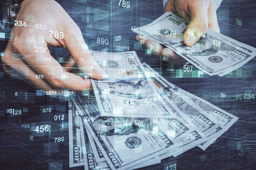 Multi exposure of technology drawing hologram and us dollars bills and man hands. Data concept