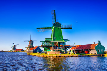 Travel Ideas.Line of Traditional Dutch Windmills in the Village of Zaanse Schans at Daytime in the...