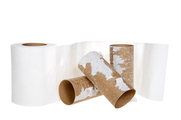 Roll of Toilet Paper with empty rolls stacked in front of it isolated on white.